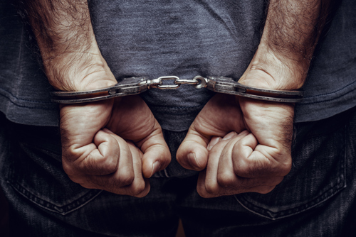 man with handcuffs after he got arrested