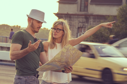 2 tourists looking at the map for directions